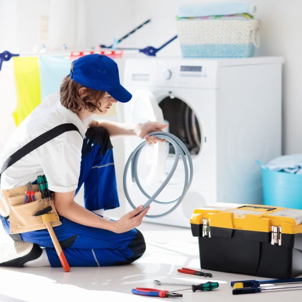 Technician Repairing the Dryer