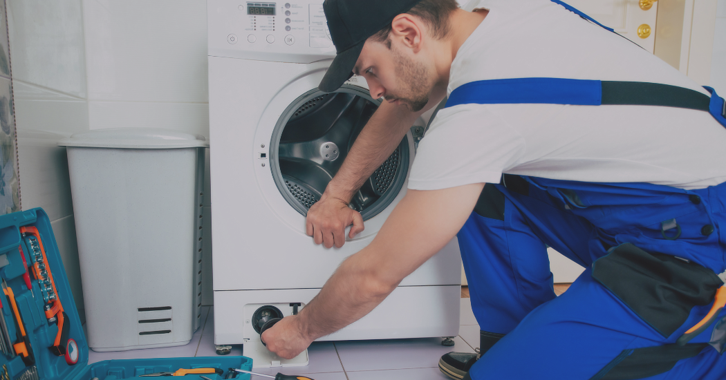 Technician Repairing the Dryer