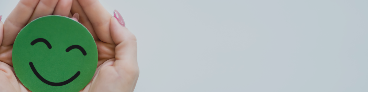 Tagline banner with smiley face
