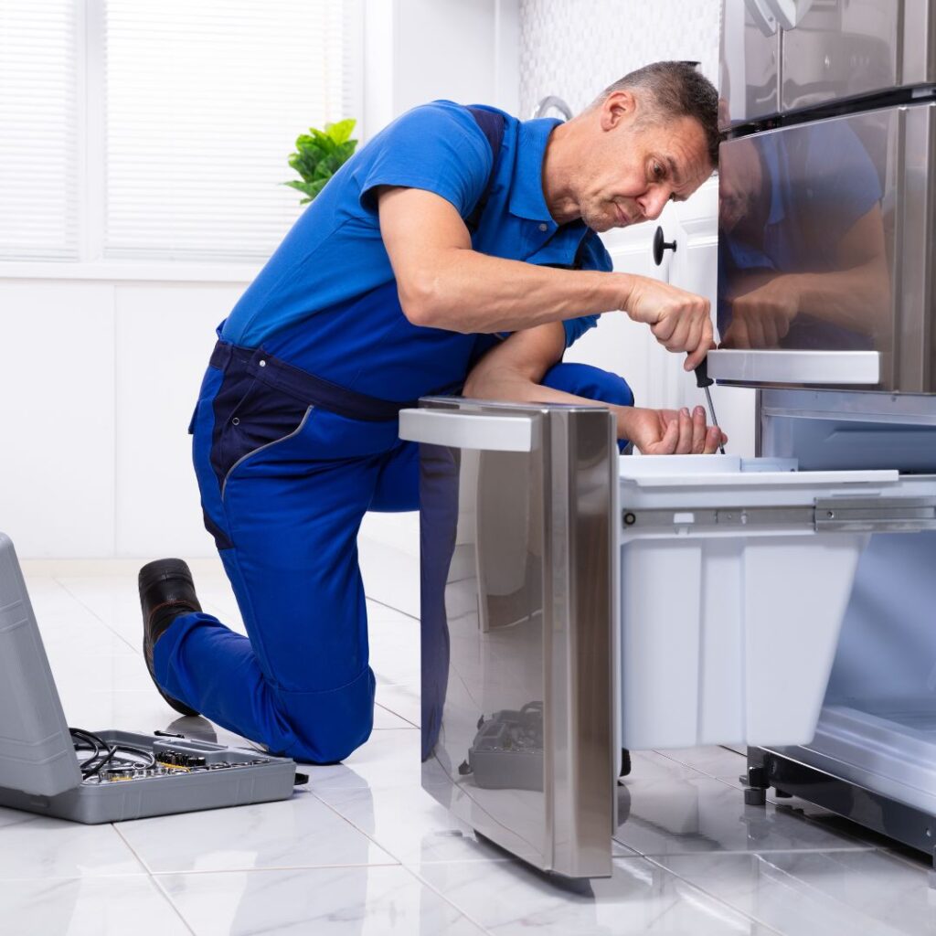 Technician Repairing the Refrigerator