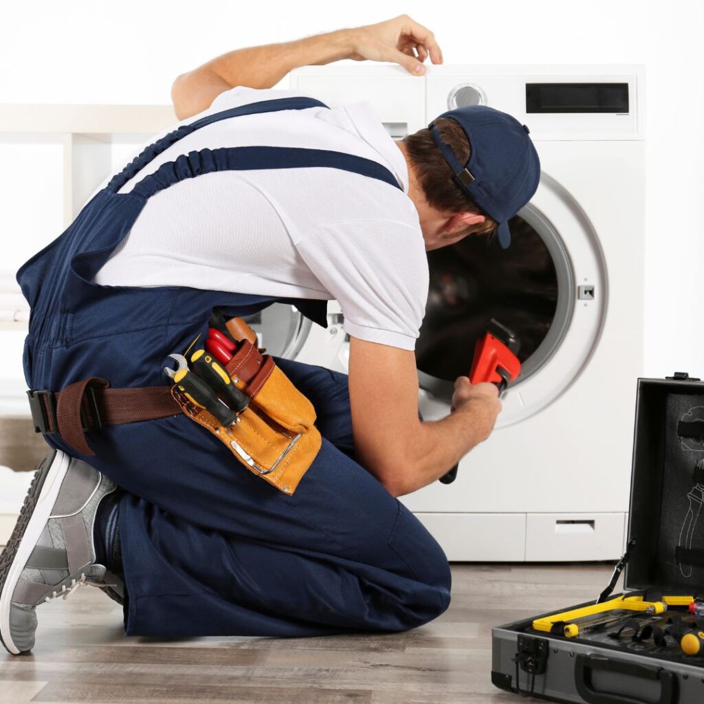 Technician repairing the washer